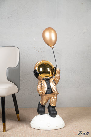 Aster - Space Guy on a Crater holding a Balloon