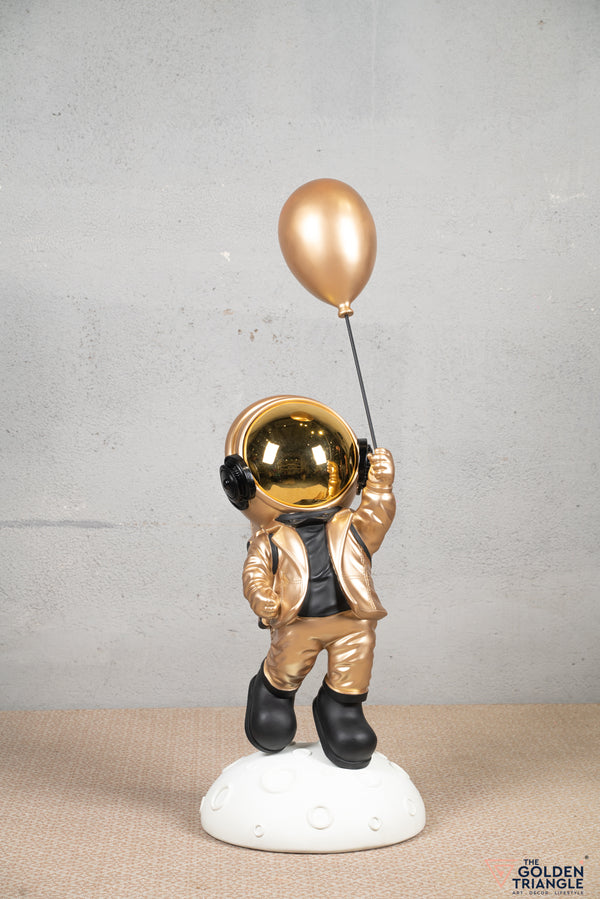Aster - Space Guy on a Crater holding a Balloon