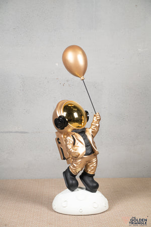 Aster - Space Guy on a Crater holding a Balloon