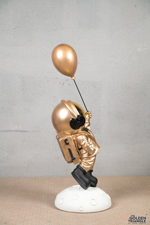 Aster - Space Guy on a Crater holding a Balloon