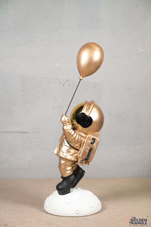 Aster - Space Guy on a Crater holding a Balloon