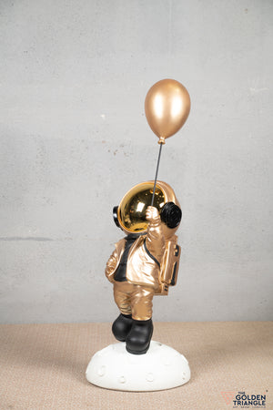Aster - Space Guy on a Crater holding a Balloon