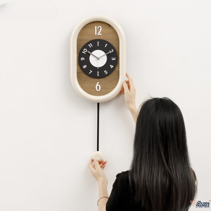 Wooden Wall Clock with pendulum in beige colour for living room