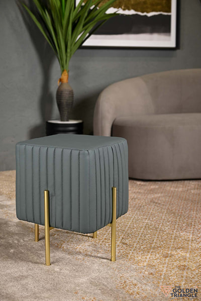 square faux leather pouffe, can be used as footstool or footrest
