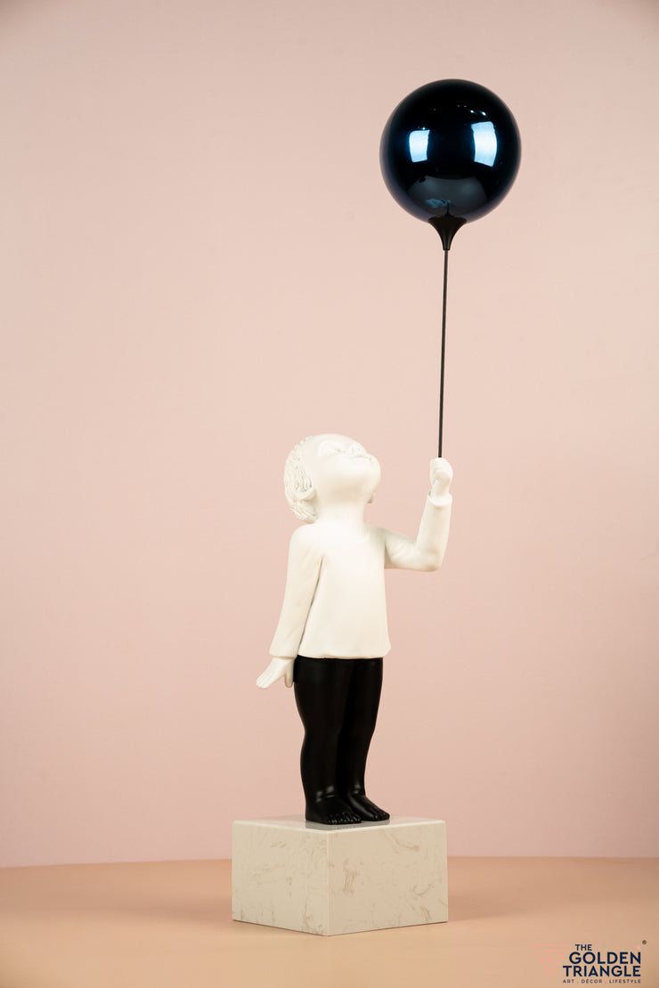 Child holding a Balloon - Blue